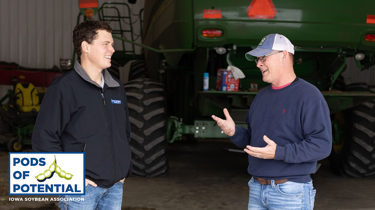 Farmer and conservation agronomist talking