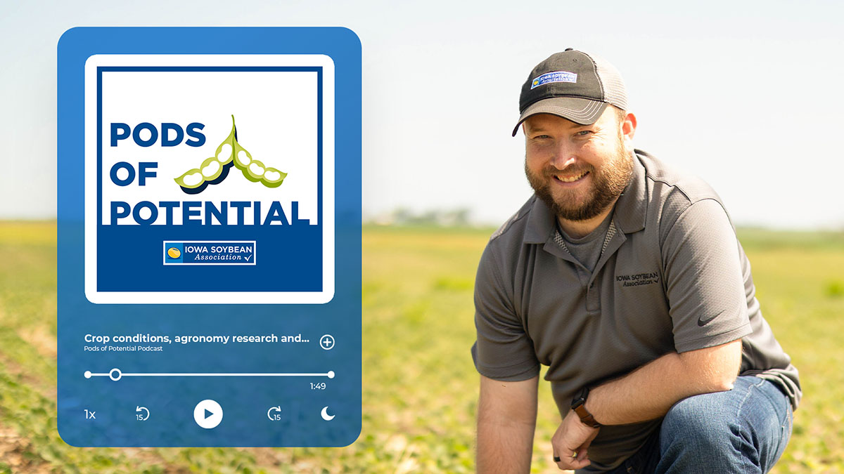 ISA Agronomist Shane Beck kneeling down