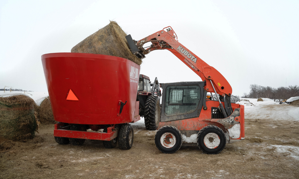 Dave Walton mixes feed for his cattle using a biodiesel