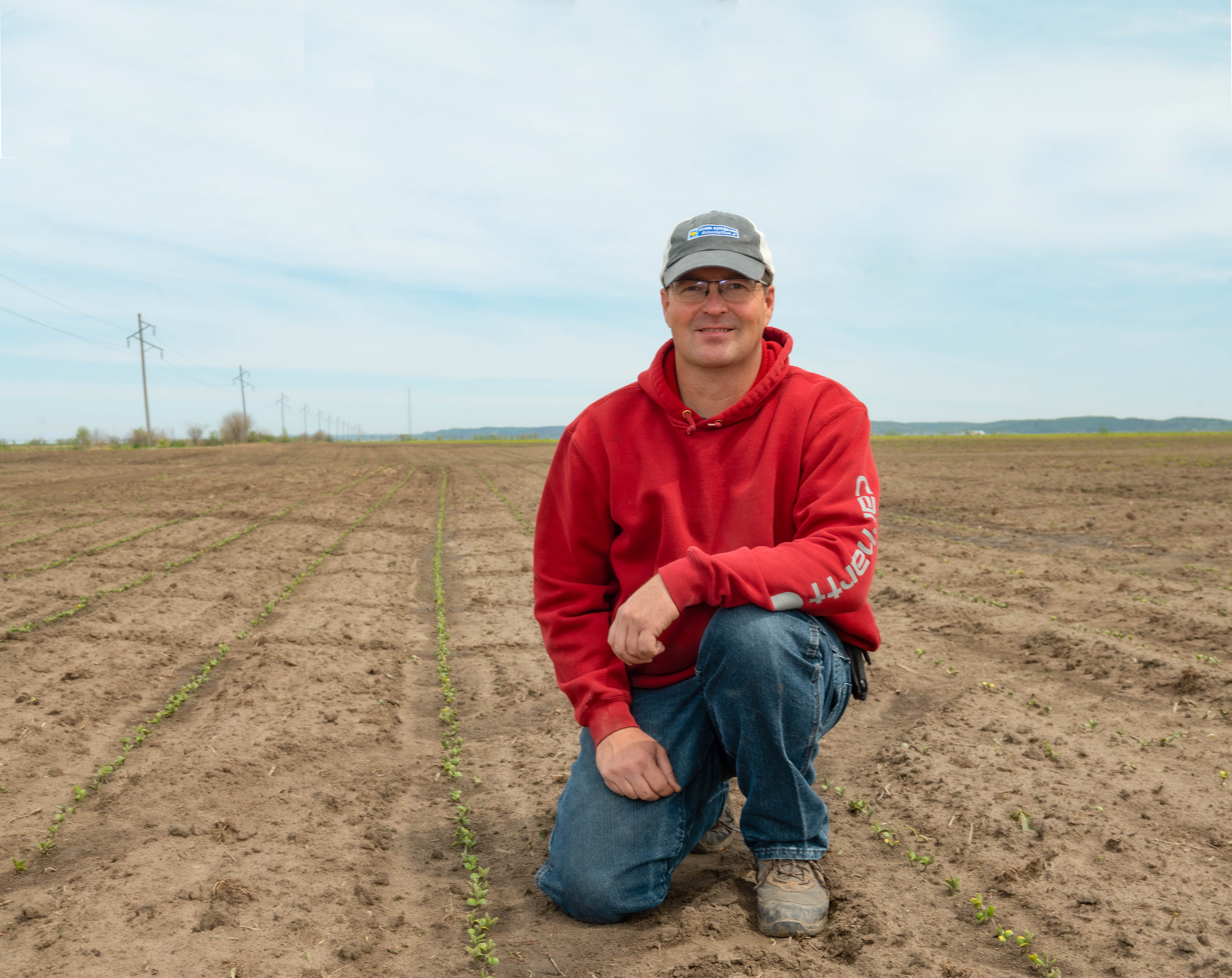 ISA President Jeff Jorgenson poses in a soybean field d