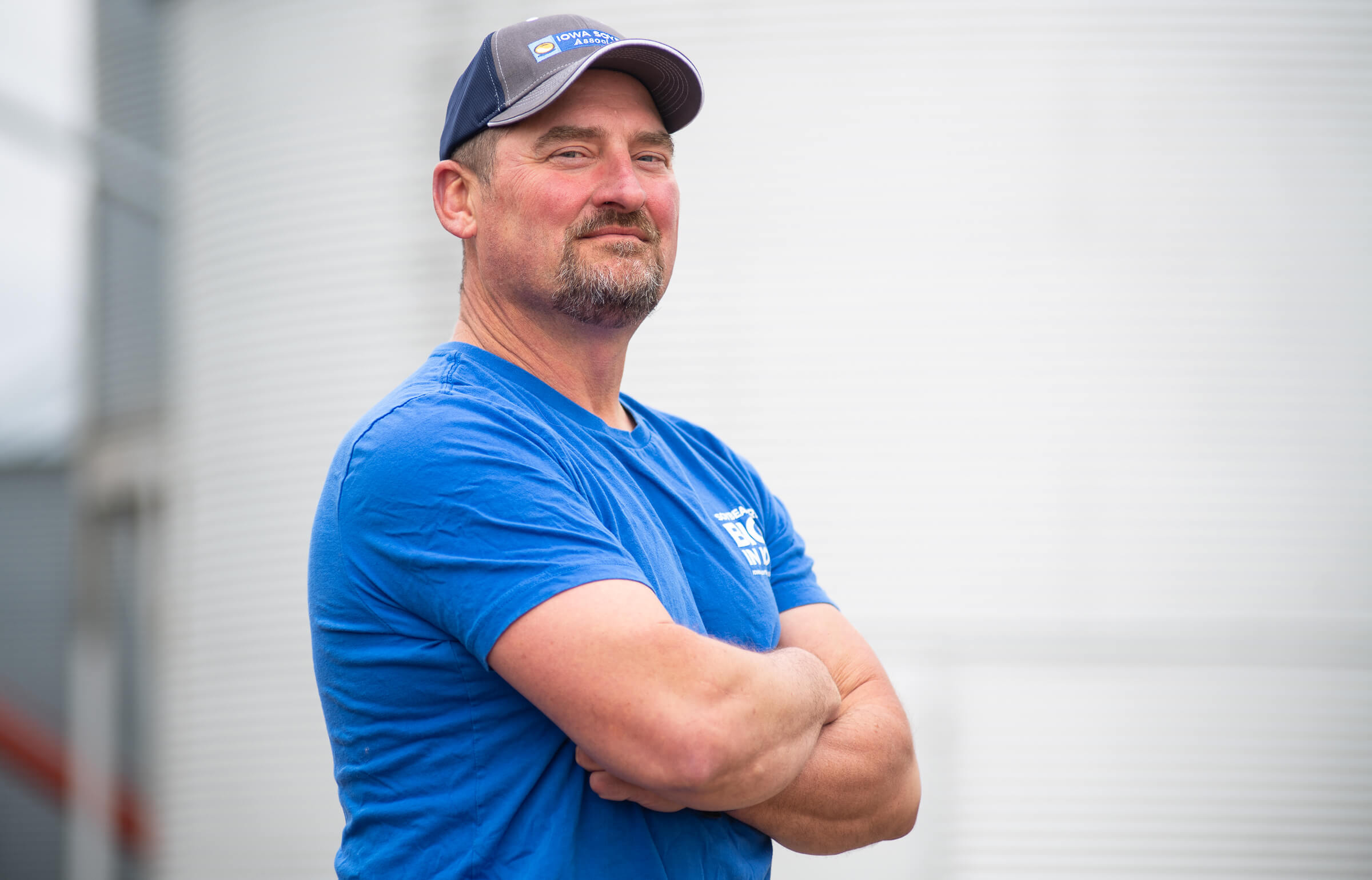 Tim Bardole posing in front of his grain bin