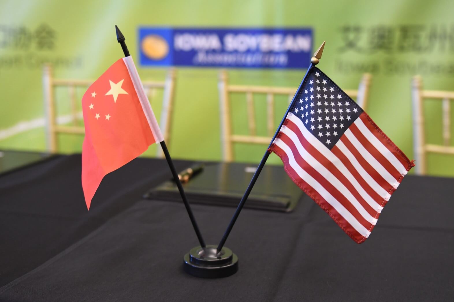 U.S. flag next to Chinese flag on small stand
