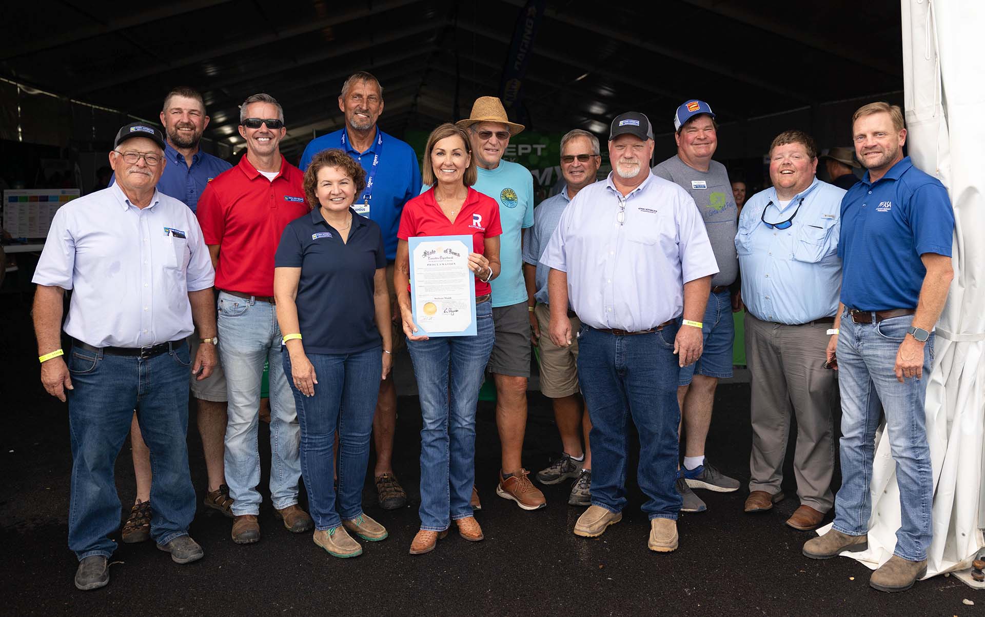 Soybean farmers with Iowa Governor Kim Reynolds at Farm