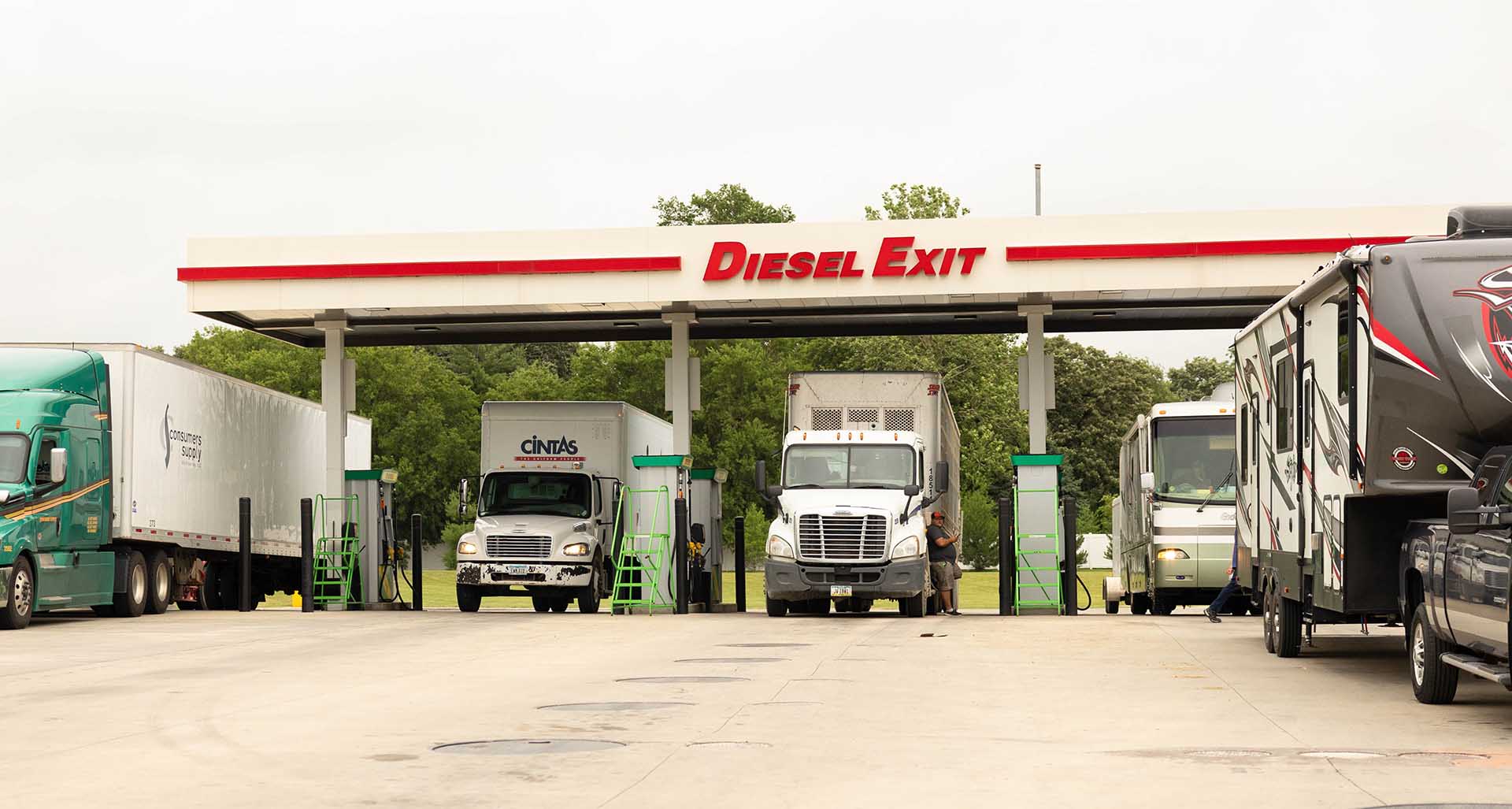 Trucks refueling at diesel pumps