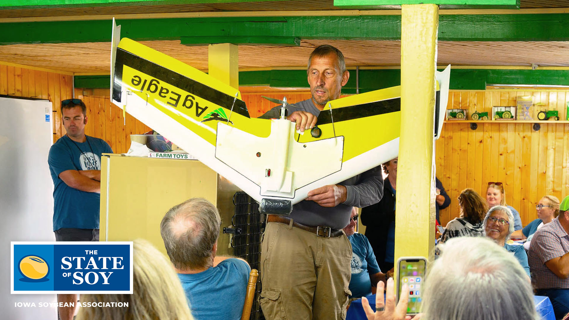 Jeff Frank holding up AgEagle aerial device