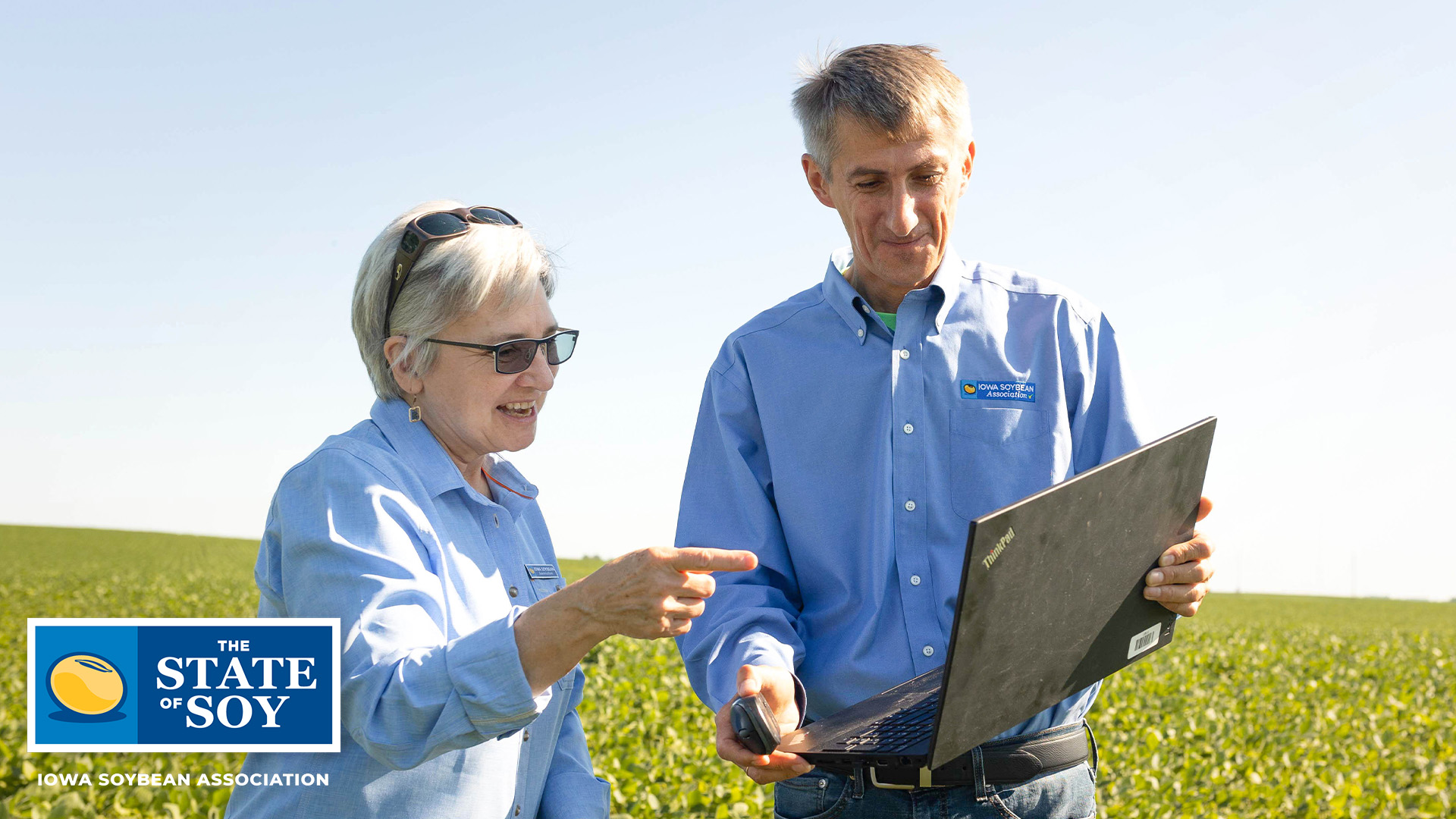 Iowa Soybean Association researchers standing in field 