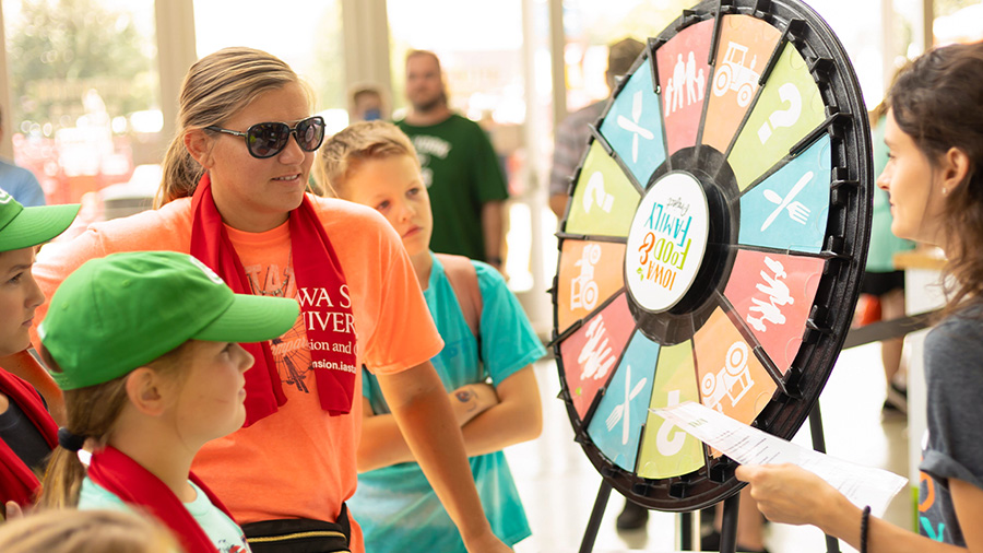 Kids spinning the wheel at the Iowa State Fair