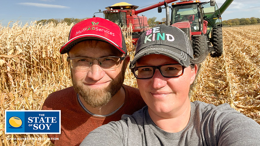 Iowa farmers in corn field during harvest