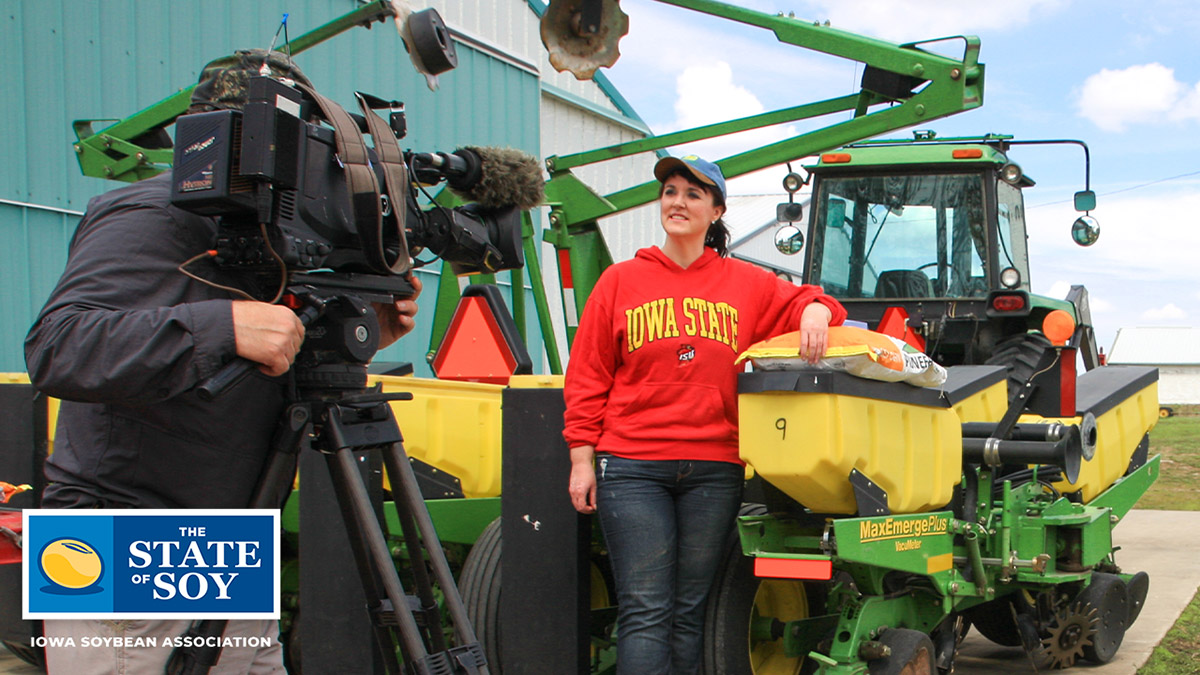 Darcy Maulsby standing next to planter