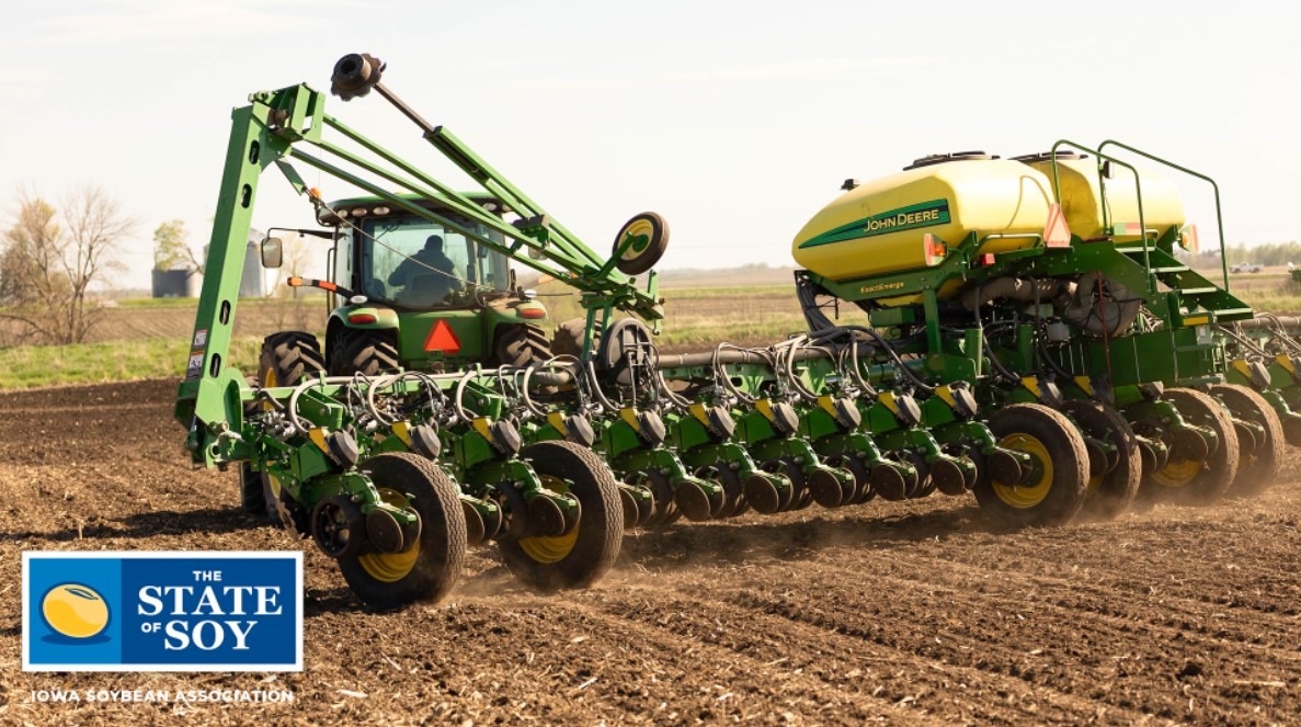 Tractor pulling planter in Iowa field