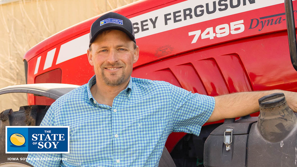 Jeff Ellis standing next to Massey Ferguson tractor