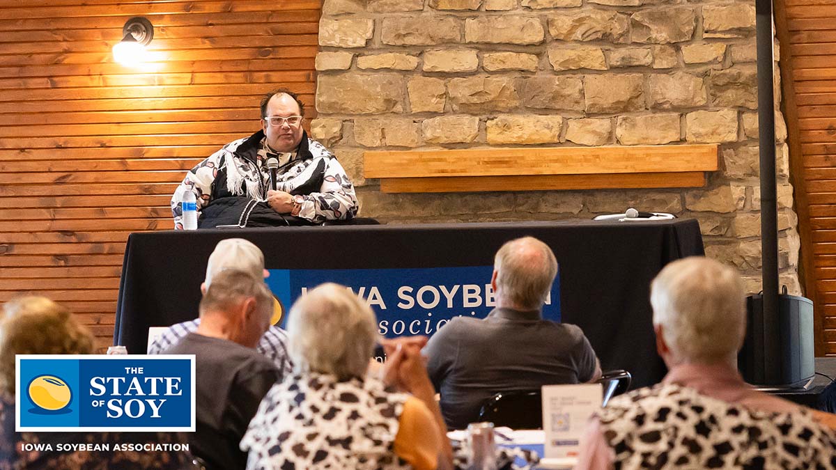 Scott Shellady speaking with farmers in Iowa