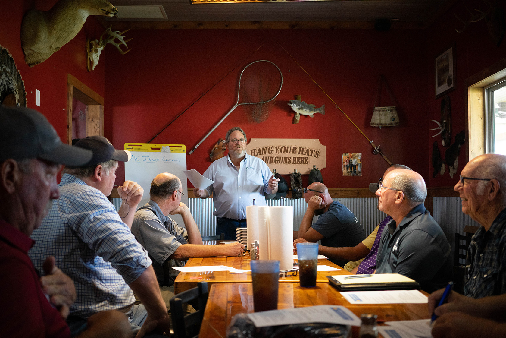 Soybean farmers gathered around a table