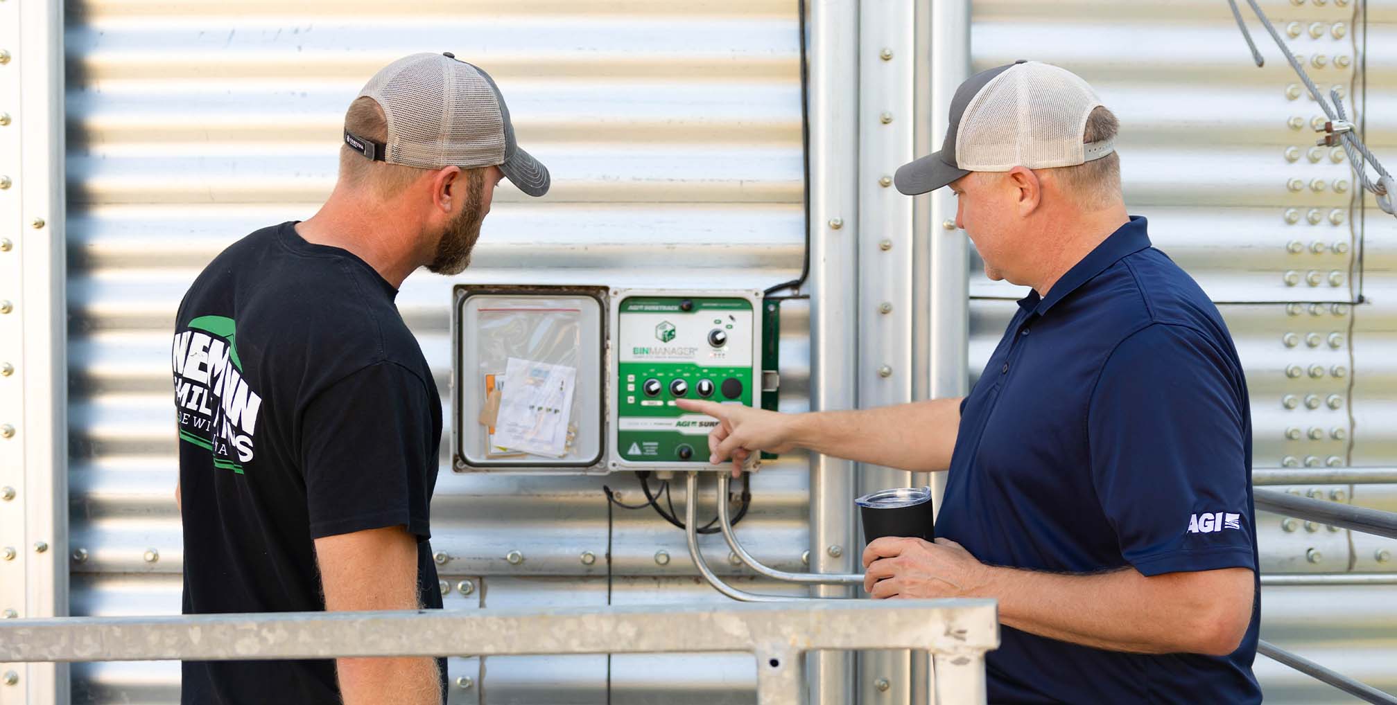 Farmer talking with AGI rep about grain